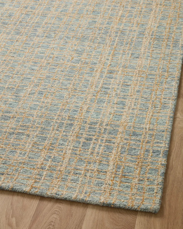 Chris Loves Julia x Loloi Polly POL-03 Blue / Sand Rug - angled corner on wood