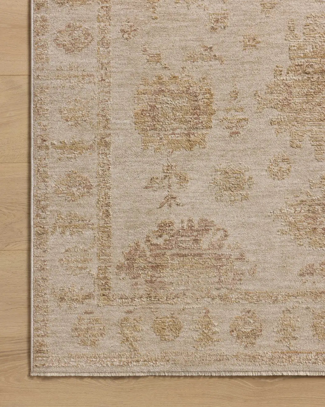 Loloi Willa WIA-07 Bone / Clay Power Loomed Rug - corner on wood