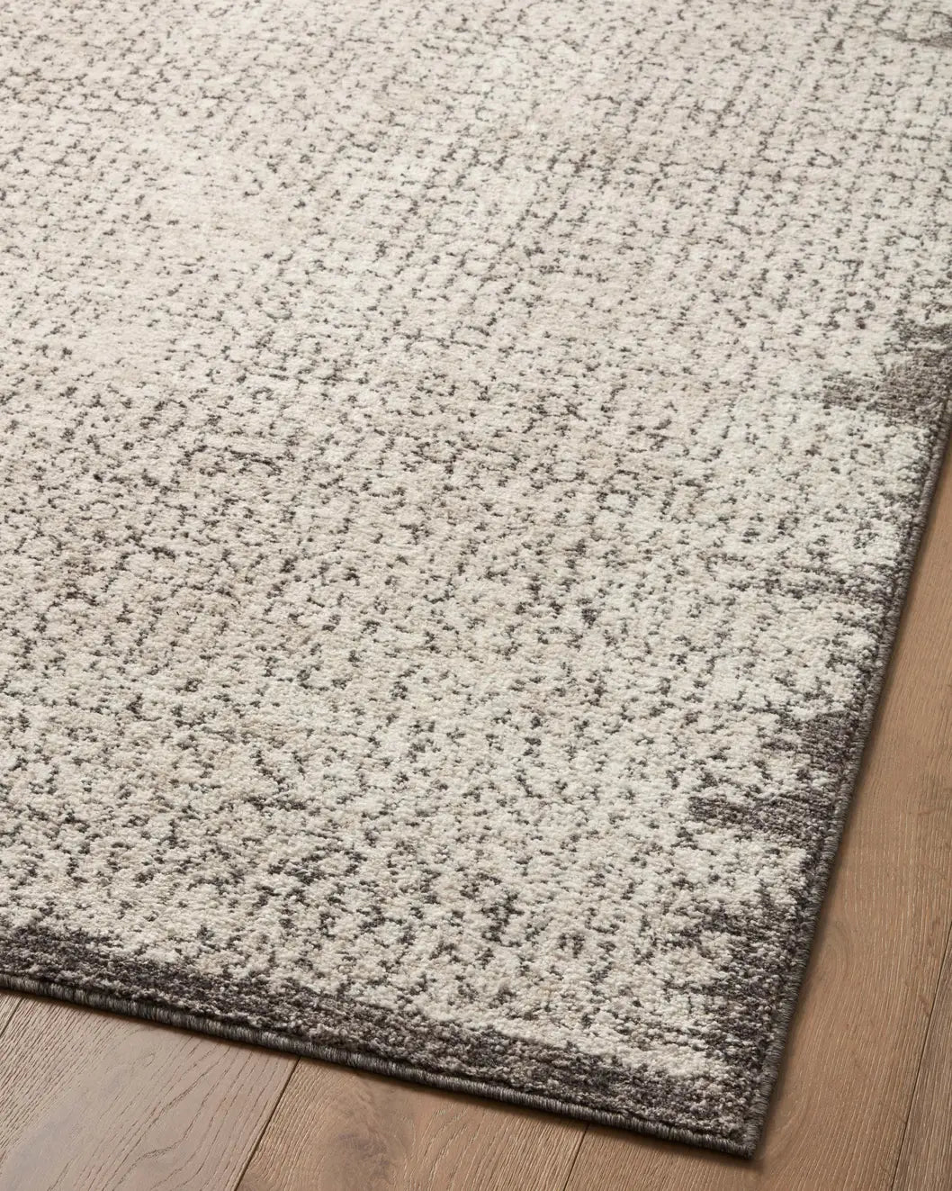 Loloi Darby Dar-04 Ivory/Stone Rug - angled corner on wood