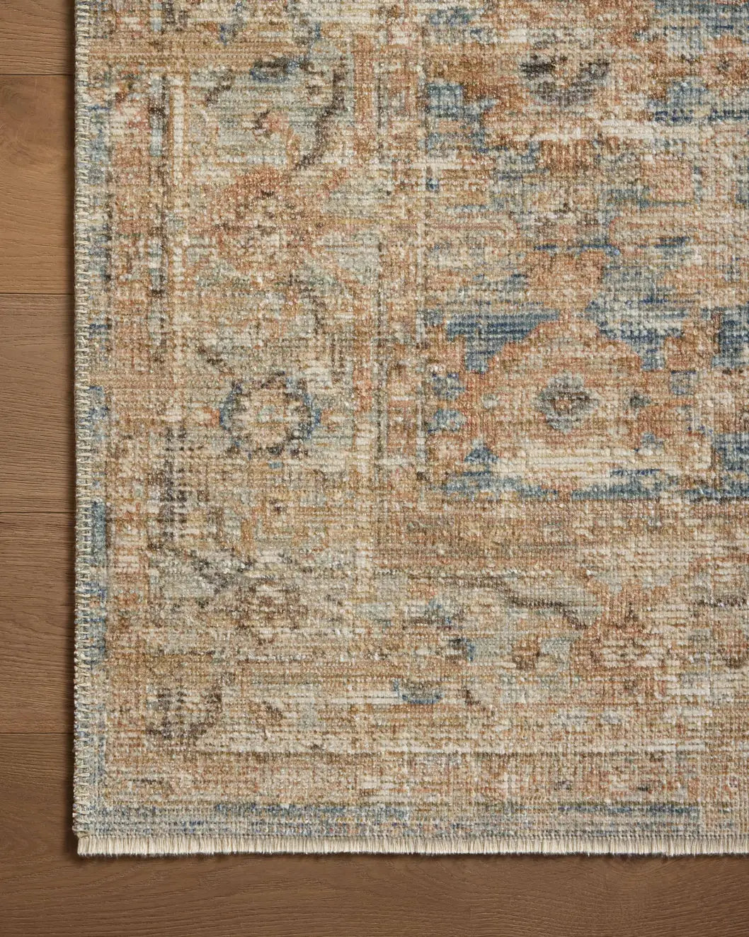 Loloi Heritage Her-15 Ocean/Sand Rug - corner on wood