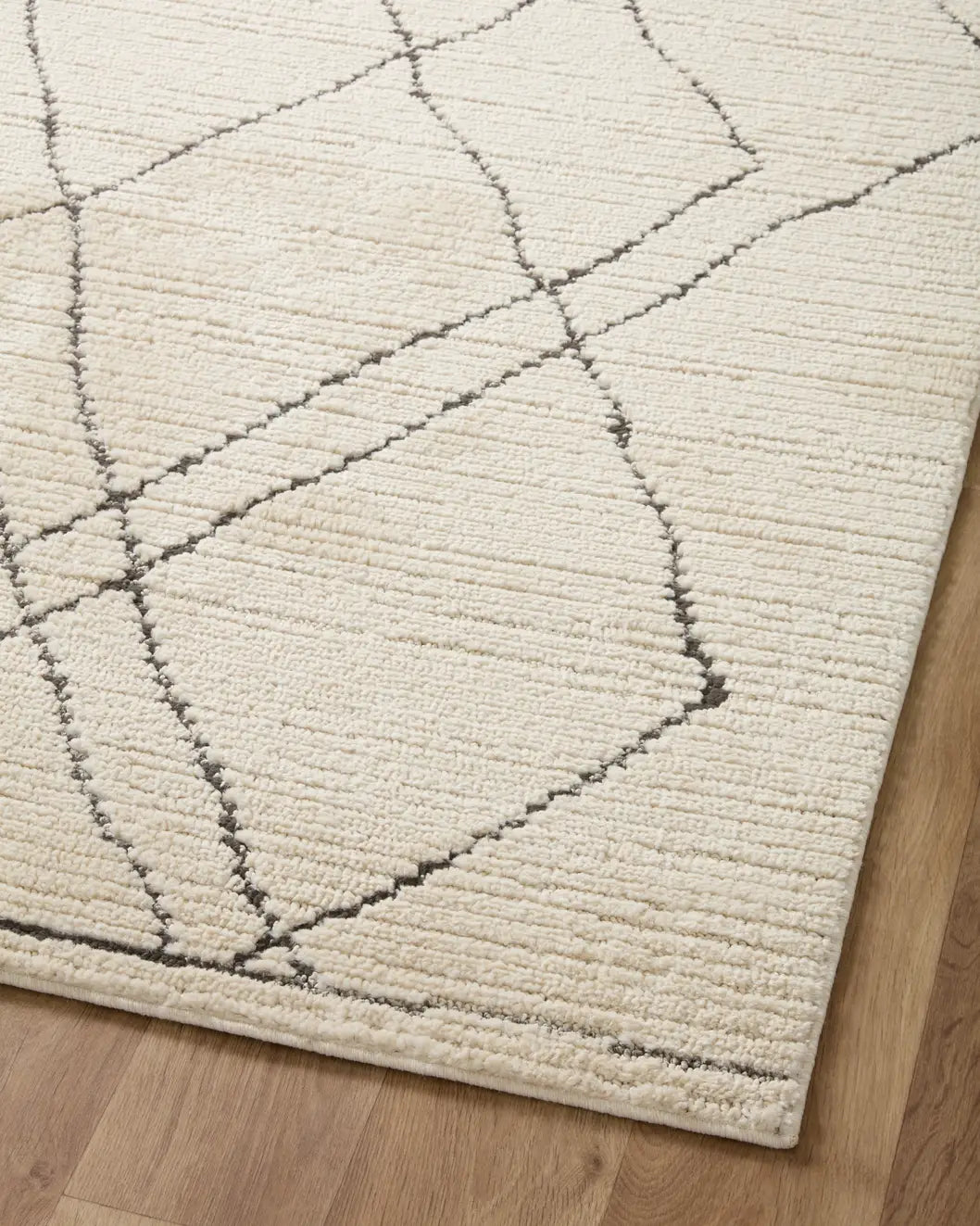 Loloi Fabian Fab-02 Ivory/Charcoal Rug - angled corner on wood