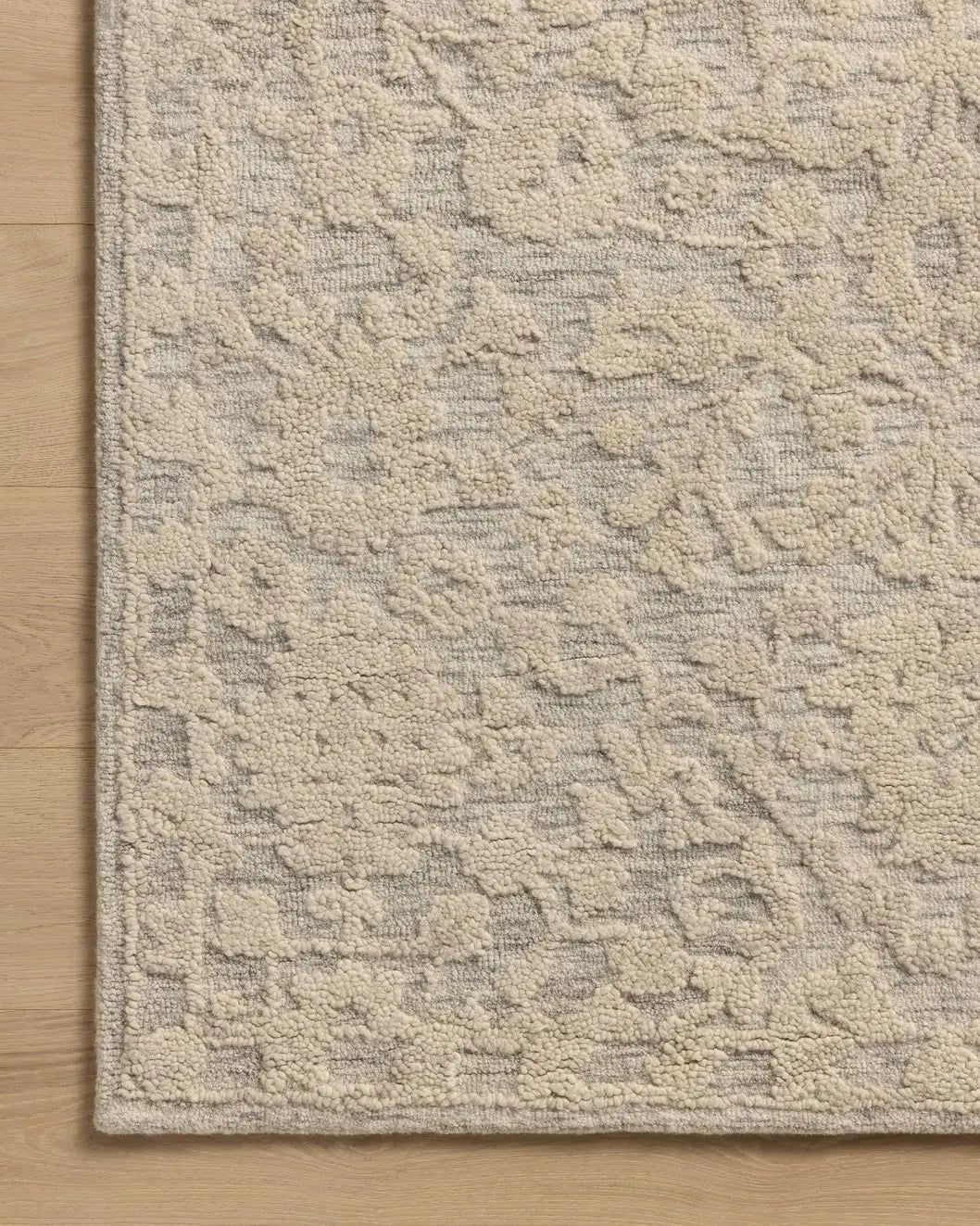 Loloi Prudence PRU-01 Mist / Ivory Hand Tufted Rug - corner on wood