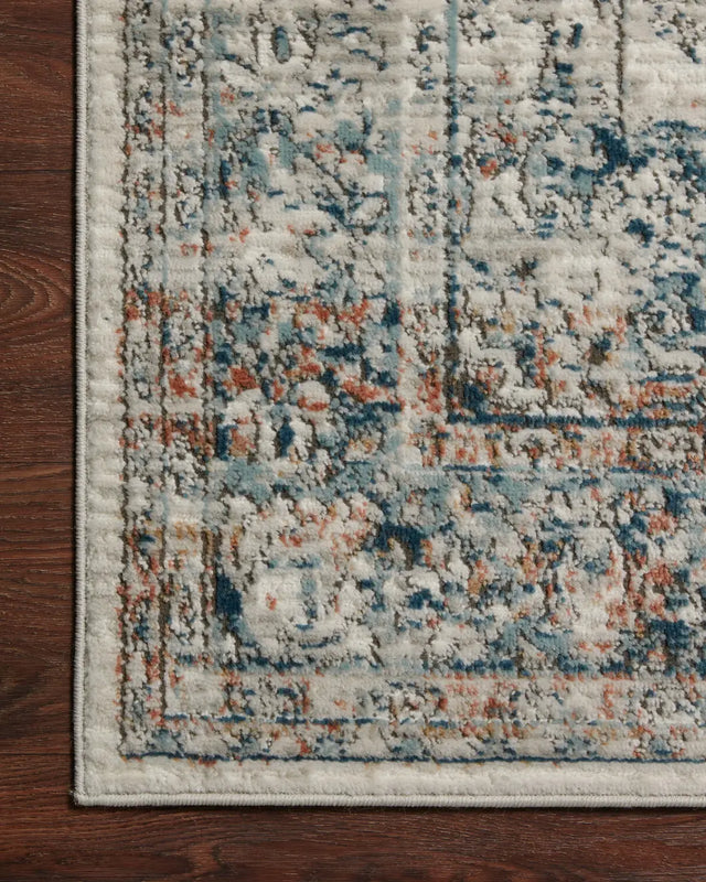 Loloi Bianca Bia-10 Ivory/Ocean Rugs - corner on wood