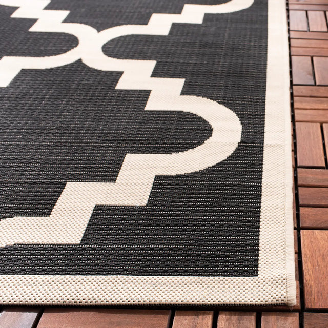 Safavieh Courtyard 5'-3" x 7'-7" Rug in Black / Beige