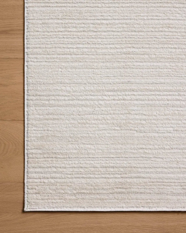 Loloi Townes TOW-02 Beige / Ivory Rug - corner on wood