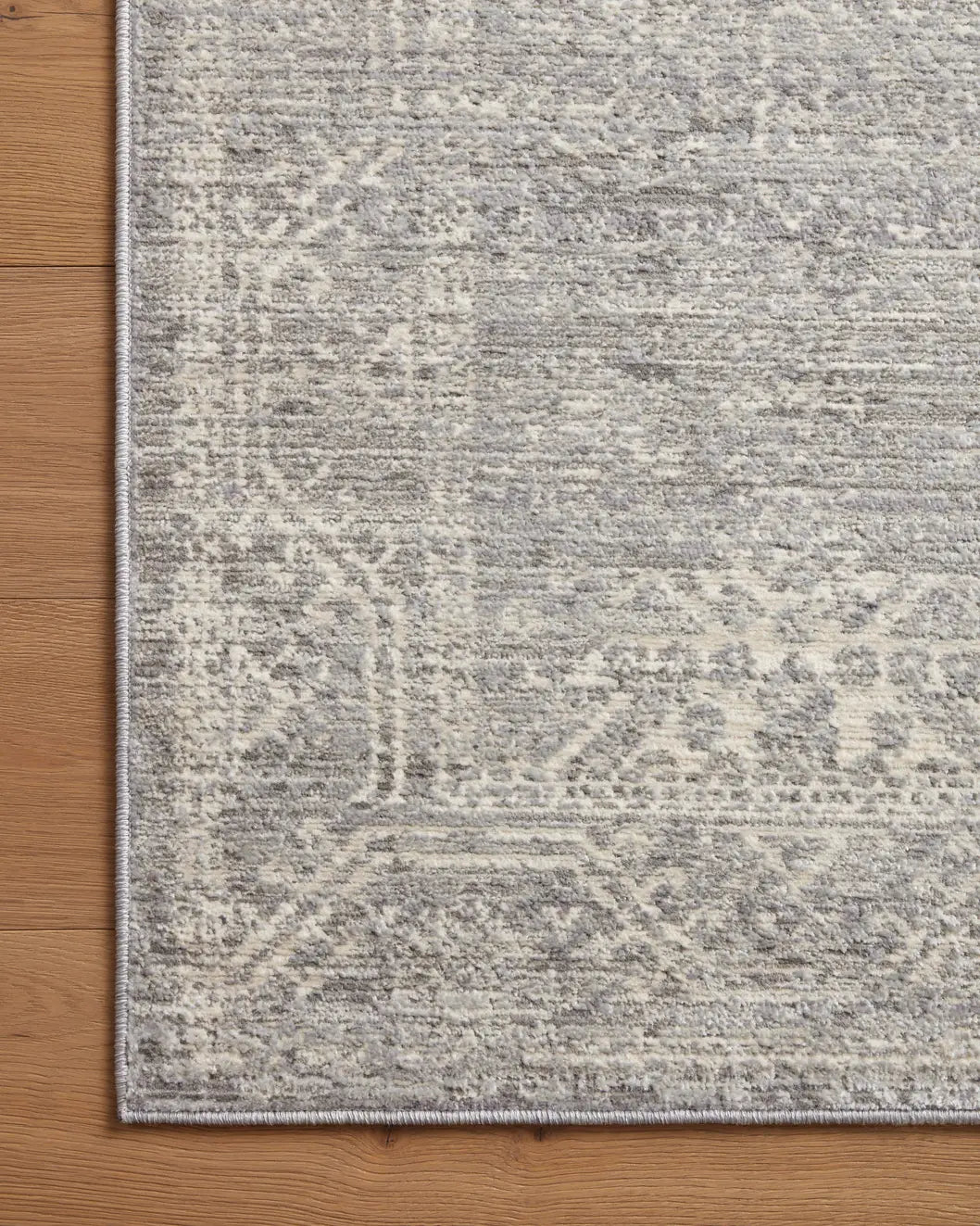 Loloi Indra Ina-02 Silver/Ivory Rug - corner on wood
