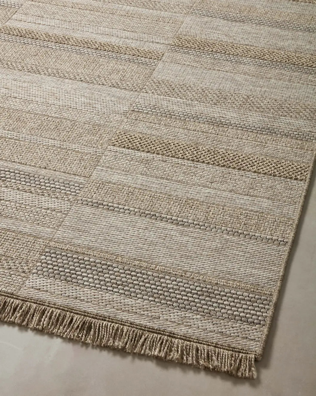 Loloi Dawn Daw-03 Natural Rug - angled corner on wood