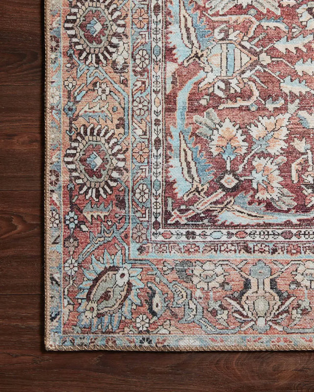 Loloi Wynter Wyn-05 Tomato/Teal Rugs - corner on wood