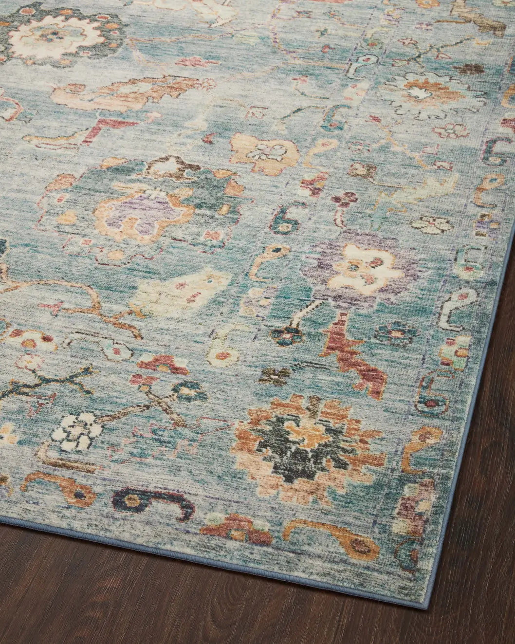 Loloi Margot Mat-06 Denim/Multi Rug - angled corner on wood