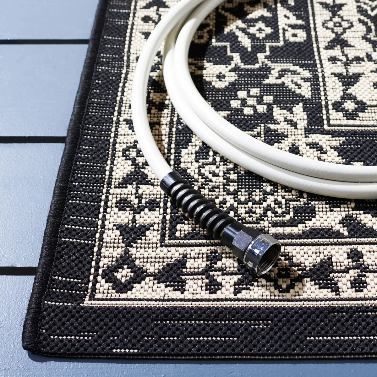 Safavieh Courtyard 5'-3" x 7'-7" Rug in Black / Ivory