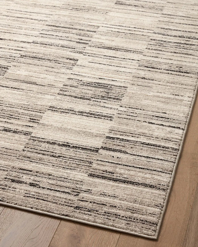 Loloi Darby Dar-01 Charcoal/Sand Rug - angled corner on wood