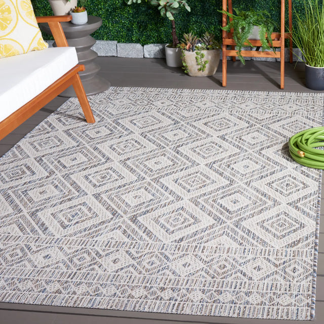 Safavieh Courtyard 5'-3" x 7'-7" Rug in Ivory Blue / Beige