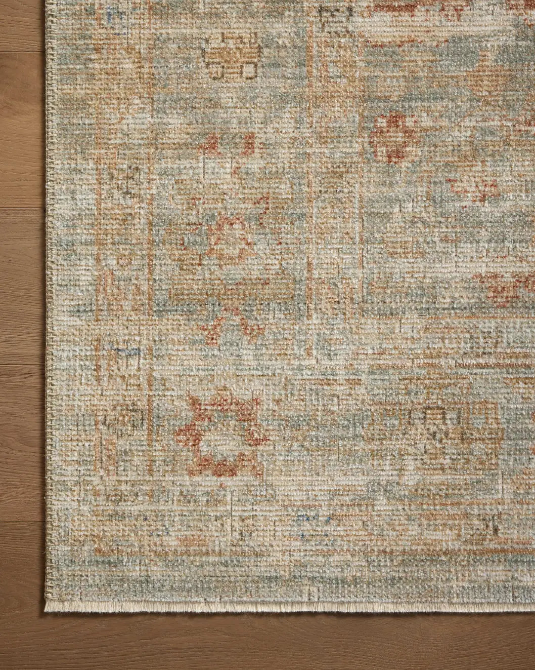Loloi Heritage Her-06 Aqua/Terracotta Rug - corner on wood