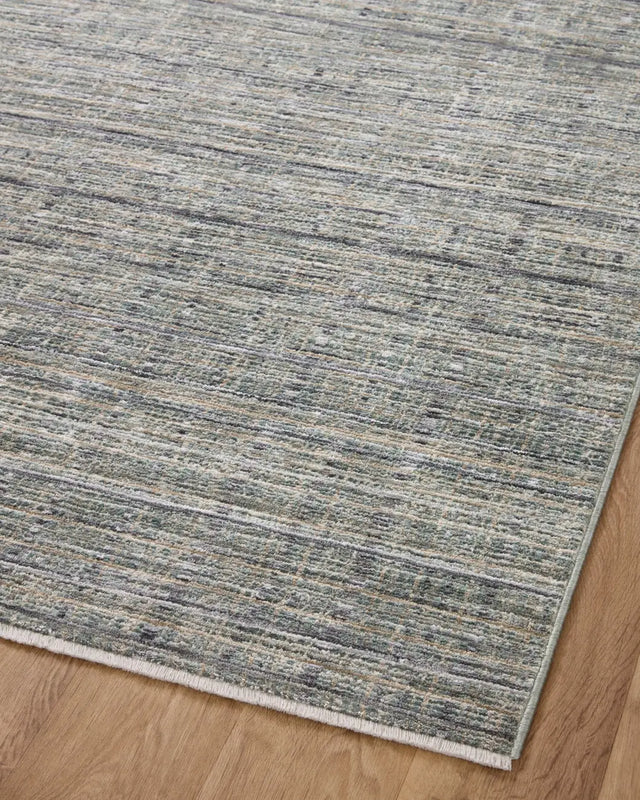 Loloi Soho Soh-04 Jade/Stone Rug - angled corner on wood