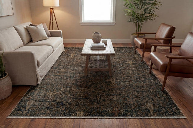 Rectangular traditional rug with black, ivory, and multicolor ornate pattern