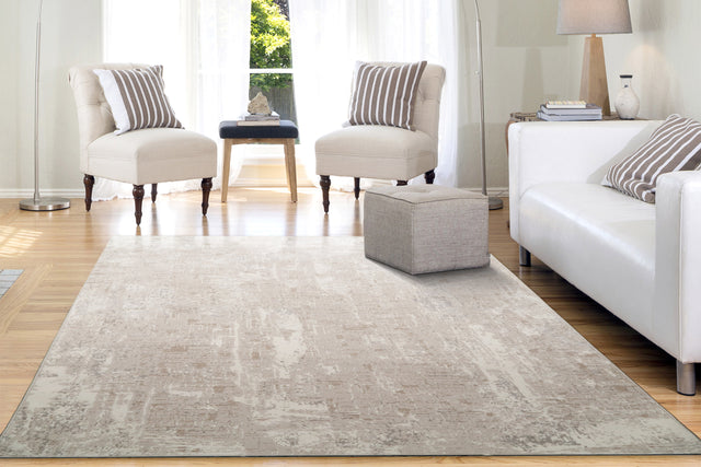 Beige and ivory modern abstract rug with low-pile distressed look