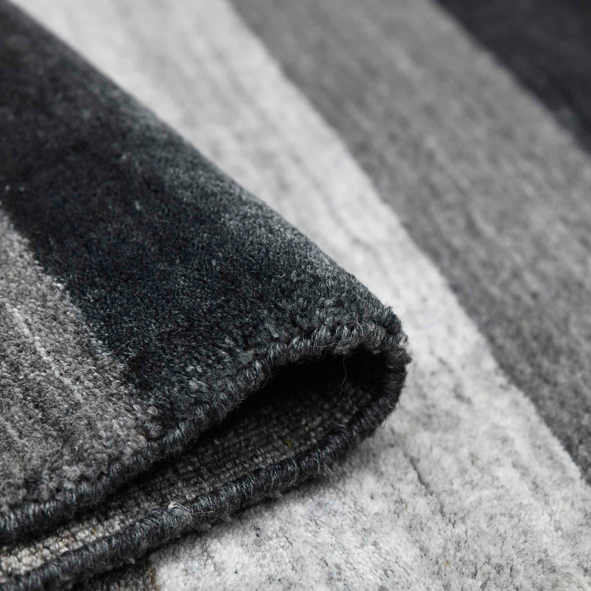 Amer Blend BLN-15 Charcoal area rug - rolled view