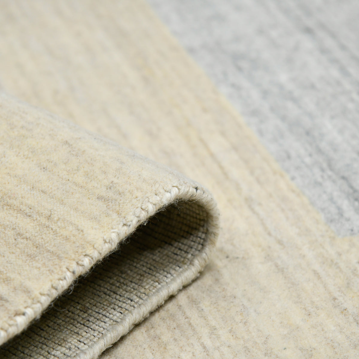 Amer Blend BLN-4 Ivory area rug - rolled view