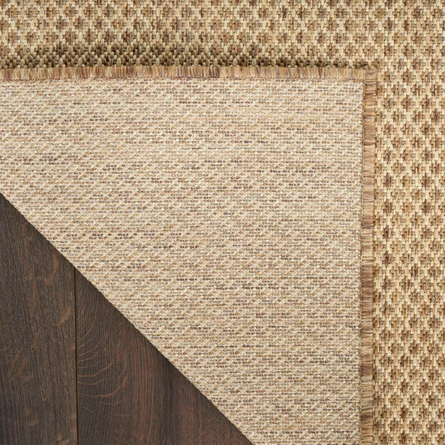 Jute rug corner with tight weave and braided border trim