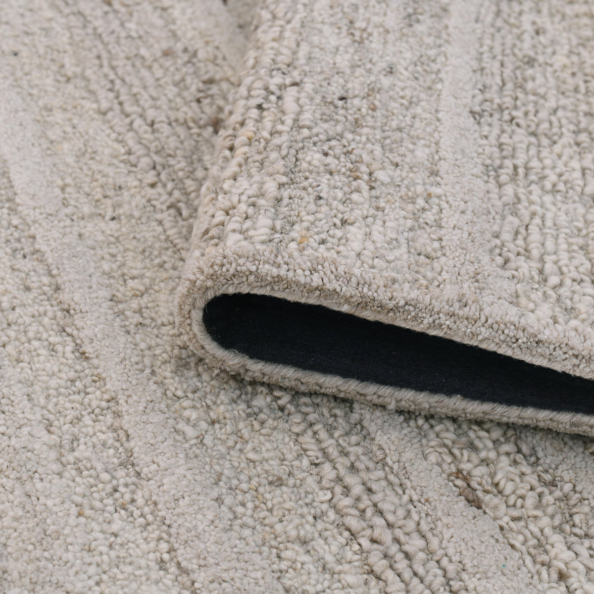 Amer Nimbus NIM-3 Beige area rug - rolled view
