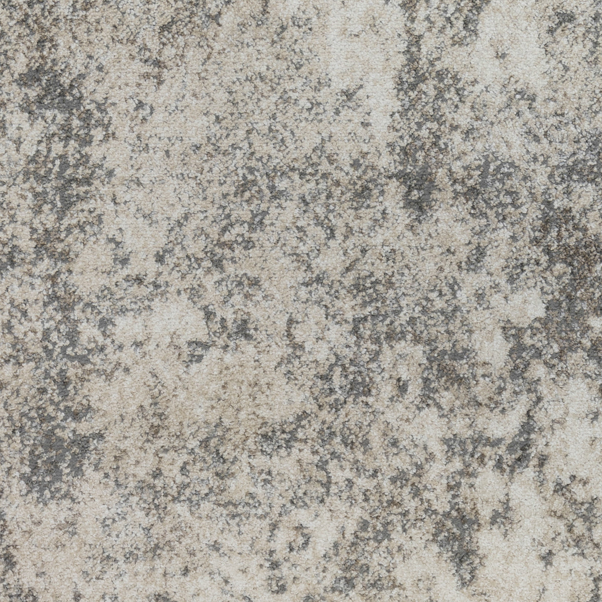 High-detail view of gray and beige abstract distressed rug pattern on short pile.