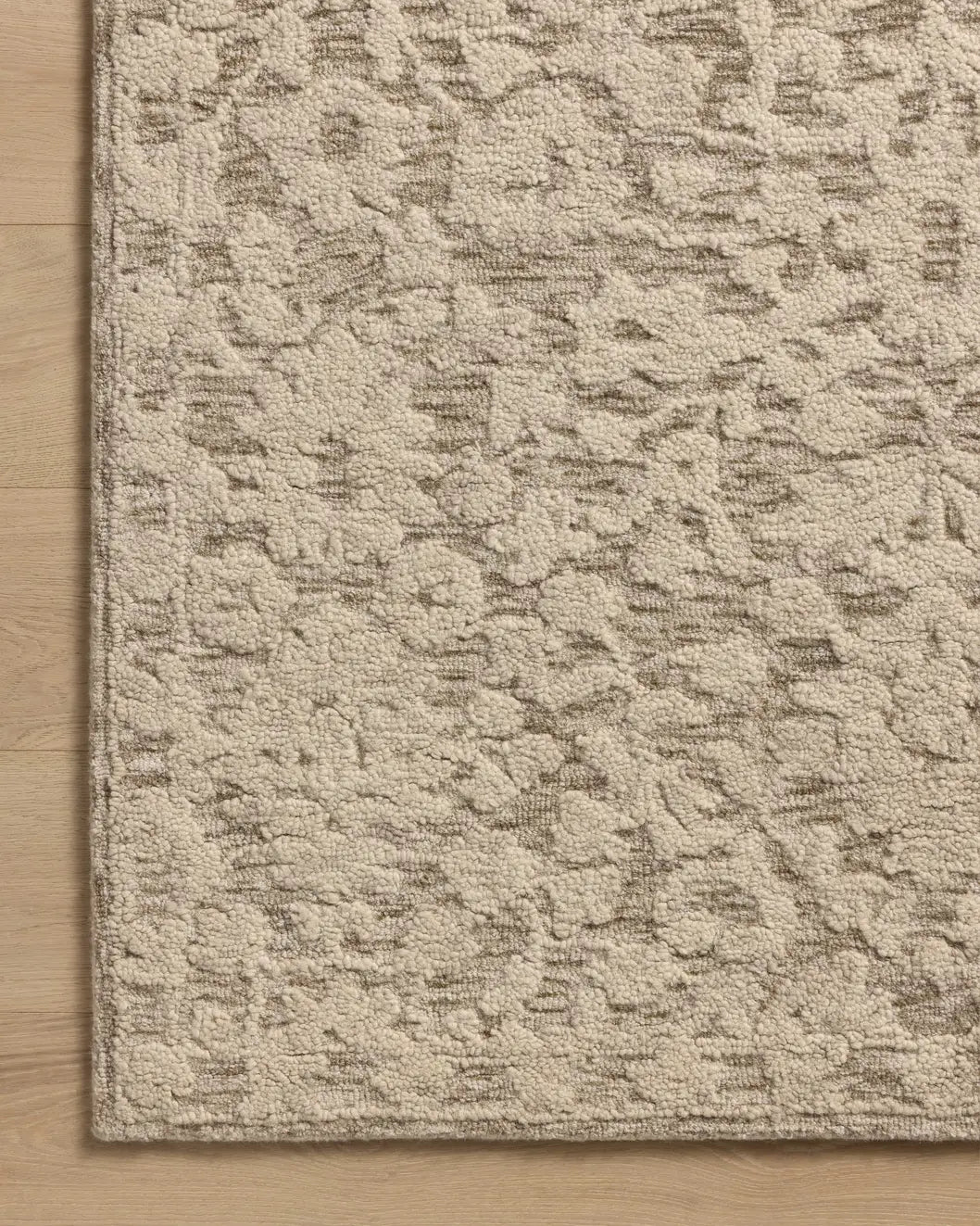 Loloi Prudence PRU-01 Stone / Ivory Hand Tufted Rug - corner on wood