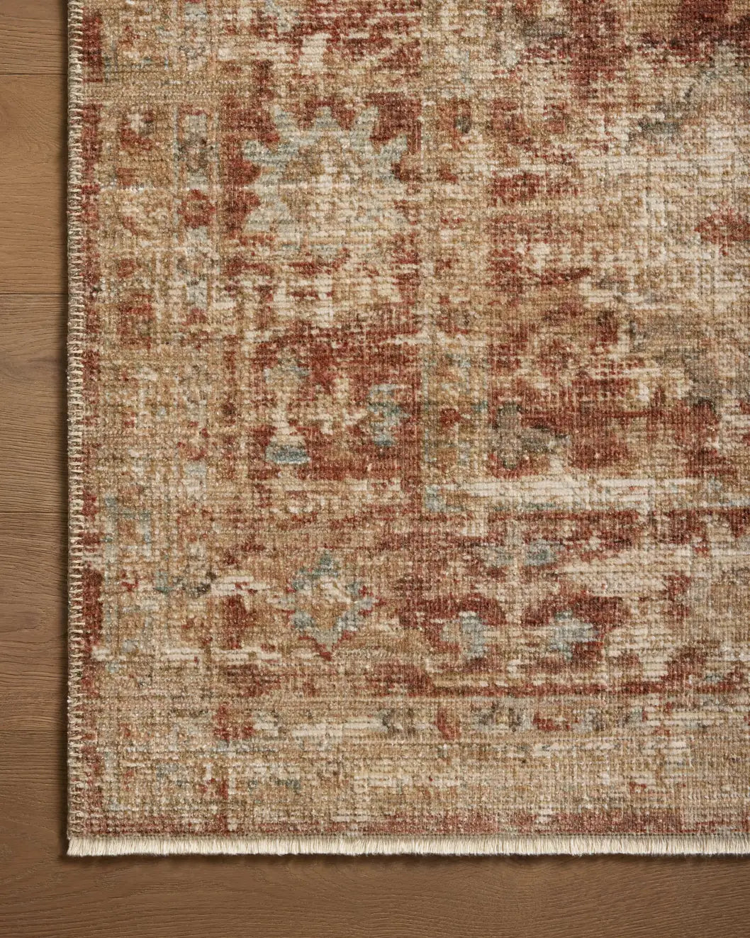 Loloi Heritage Her-03 Brick/Multi Rug - corner on wood