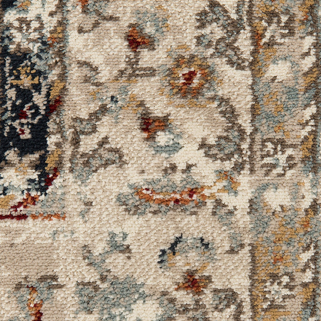 Close-up of ivory area rug texture with multicolor abstract motif and speckled pile
