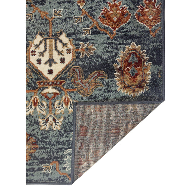 Teal blue bordered area rug with ornate multicolor medallion pattern and corner motifs