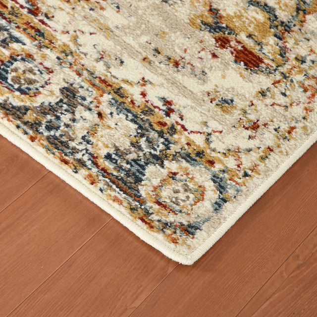 Rectangle area rug with beige background and ornate medallion pattern in blue and rust