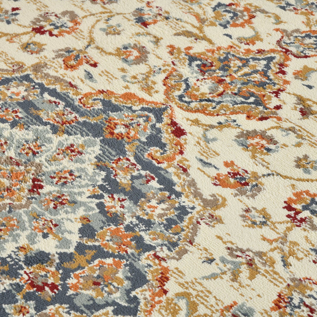 Ivory and navy medallion area rug with ornamental scrolls and dotted accents