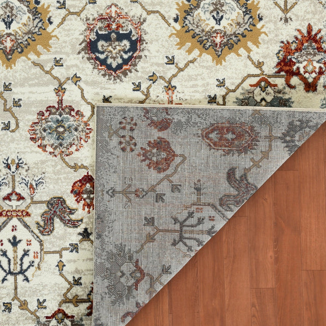 Beige oriental area rug corner showing reverse side with muted blue pattern