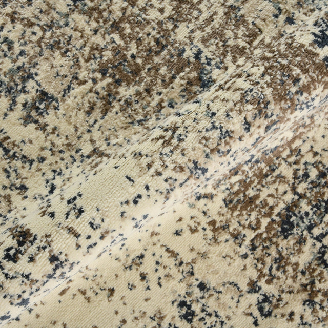 Area rug texture detail with cream ground and scattered blue and brown flecks