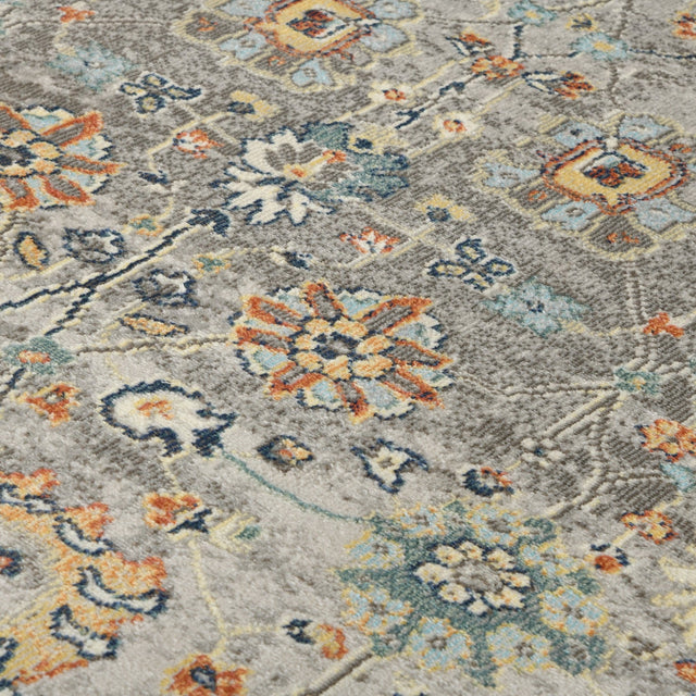 Gray bohemian floral area rug with ornate multicolor motifs, textured pile close-up