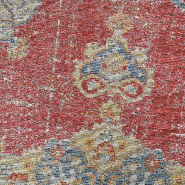 Multicolor medallion rug close-up with burgundy red, blue, yellow, and cream pattern