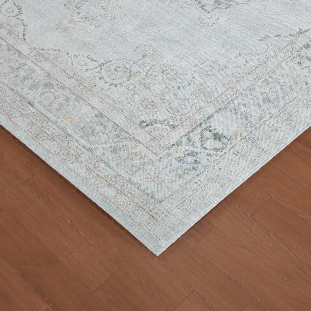Sea mist vintage medallion area rug corner with border trim and distressed pattern