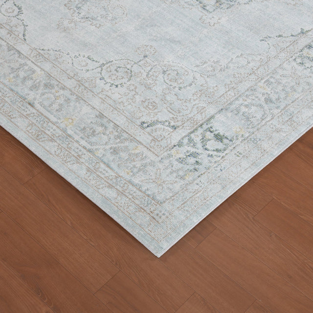 Sea mist vintage medallion area rug corner with border trim and distressed pattern