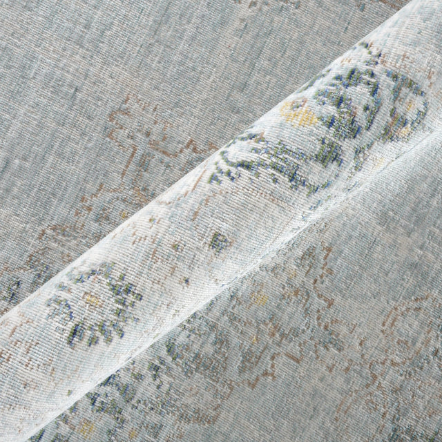 Sea mist medallion area rug close-up with textured border stripe and speckled pattern