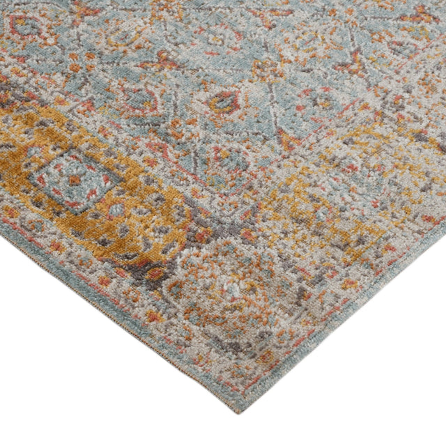 Teal and gold-bordered area rug with multicolor distressed medallion pattern