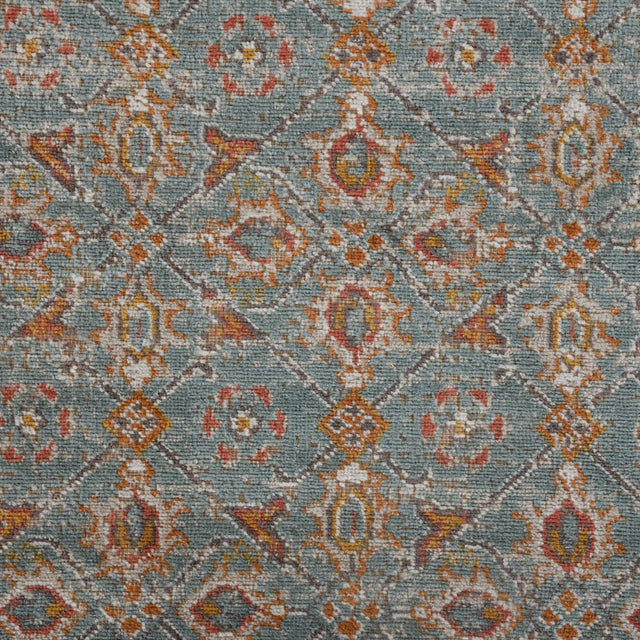 Teal area rug with diamond lattice and multicolor distressed motif pattern