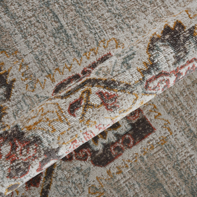 Beige and sand area rug with distressed medallion pattern in rust, black, and gray