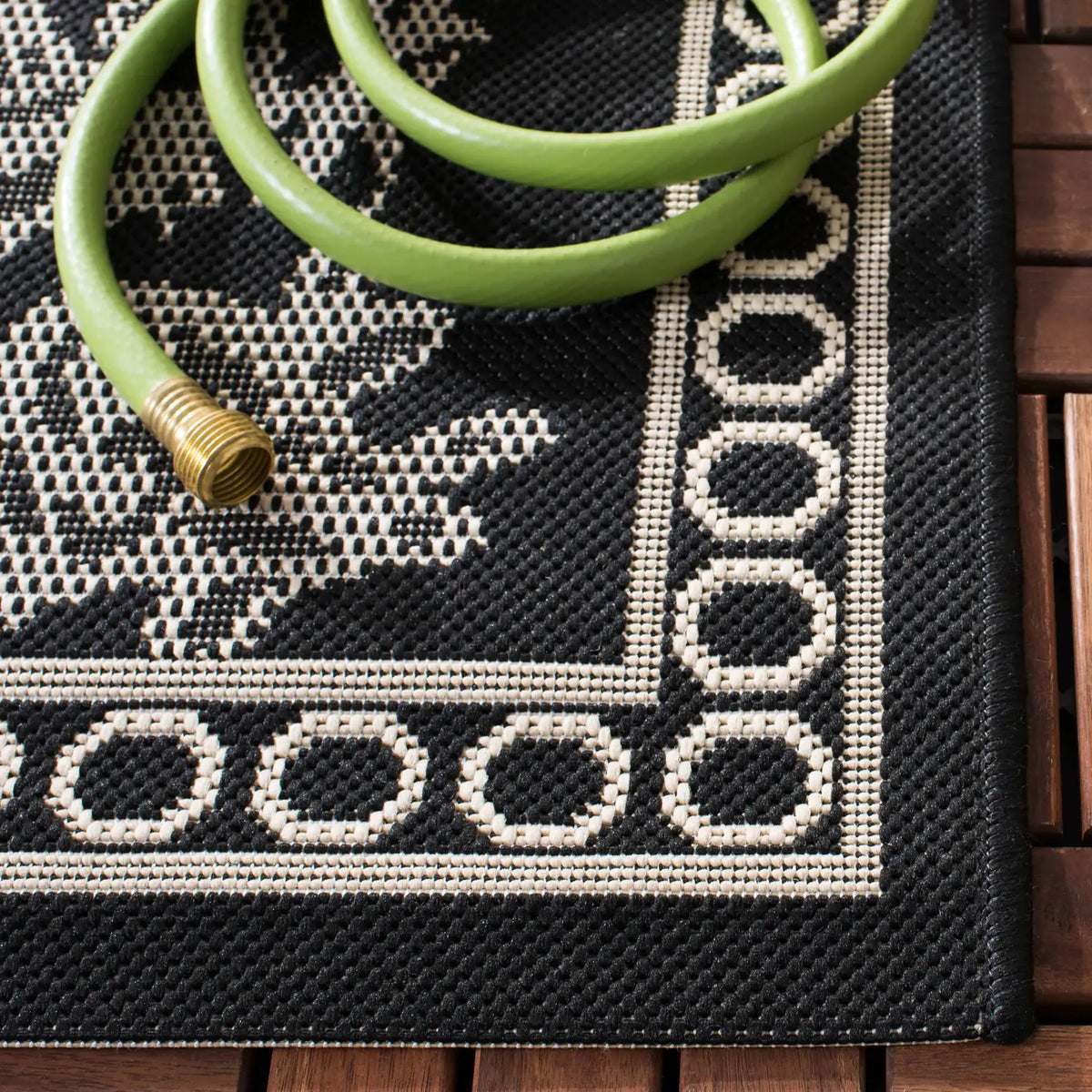 Safavieh Courtyard 5'-3" x 7'-7" Rug in Black / Sand