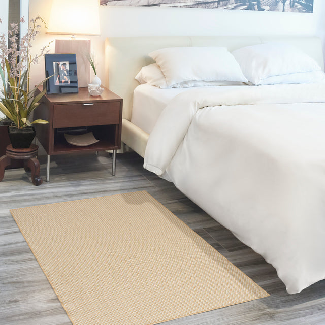 Natural lattice rug runner with tan border, flat woven texture