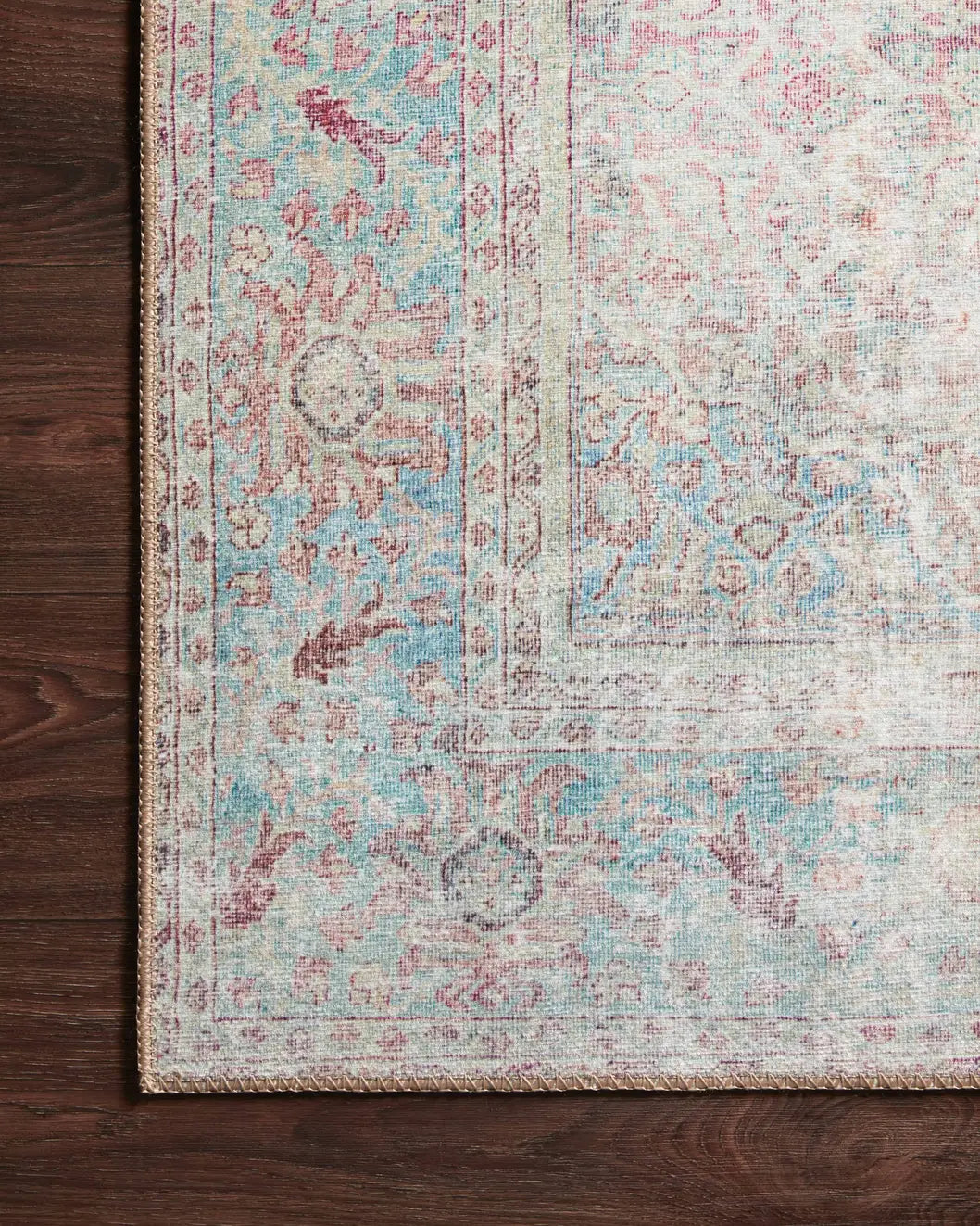Loloi Wynter Wyn-04 Red/Teal Rugs - corner on wood