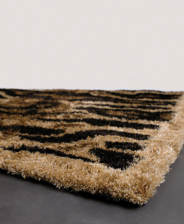 Chandra Amazon AMA-5603 Tan and Gold and Brown and Black rug, corner detail