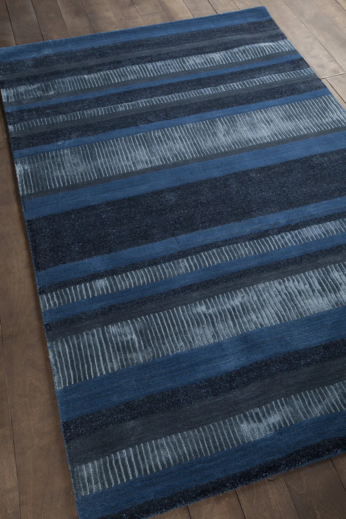 Chandra Amigo AMI-30503 Blue and Charcoal rug, angled side view