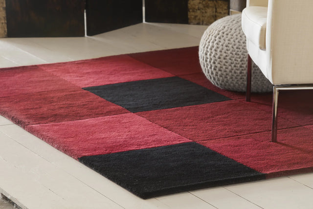 Chandra Antara ANT-109 Red and Black rug, shown in a styled room setting