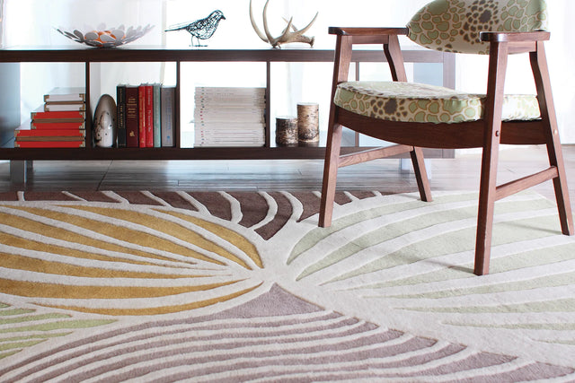 Chandra Inhabit INH-21621 White and Green and Orange and Grey and Brown rug, shown in a styled room setting