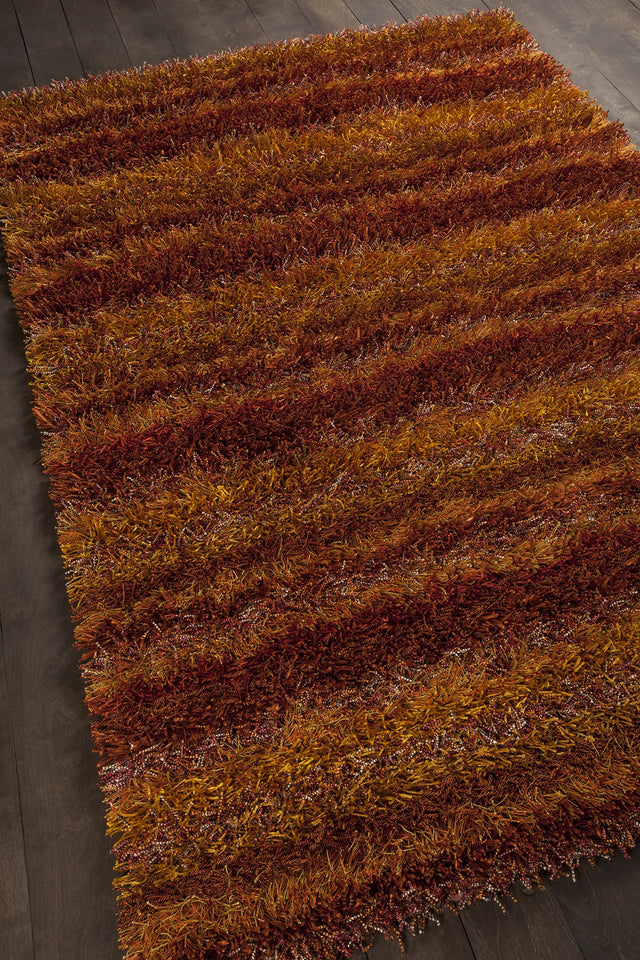 Chandra Kubu KUB-16500 Red and Orange and Brown rug, angled side view