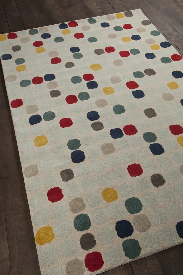 Chandra Stella STE-52219 Cream and Beige and Red and Yellow and Blue rug, angled side view